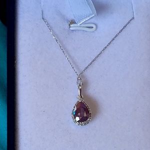 10k wg 1.5ctw intense blue green pear cut topaz with 24 diamonds 1/8ctw.